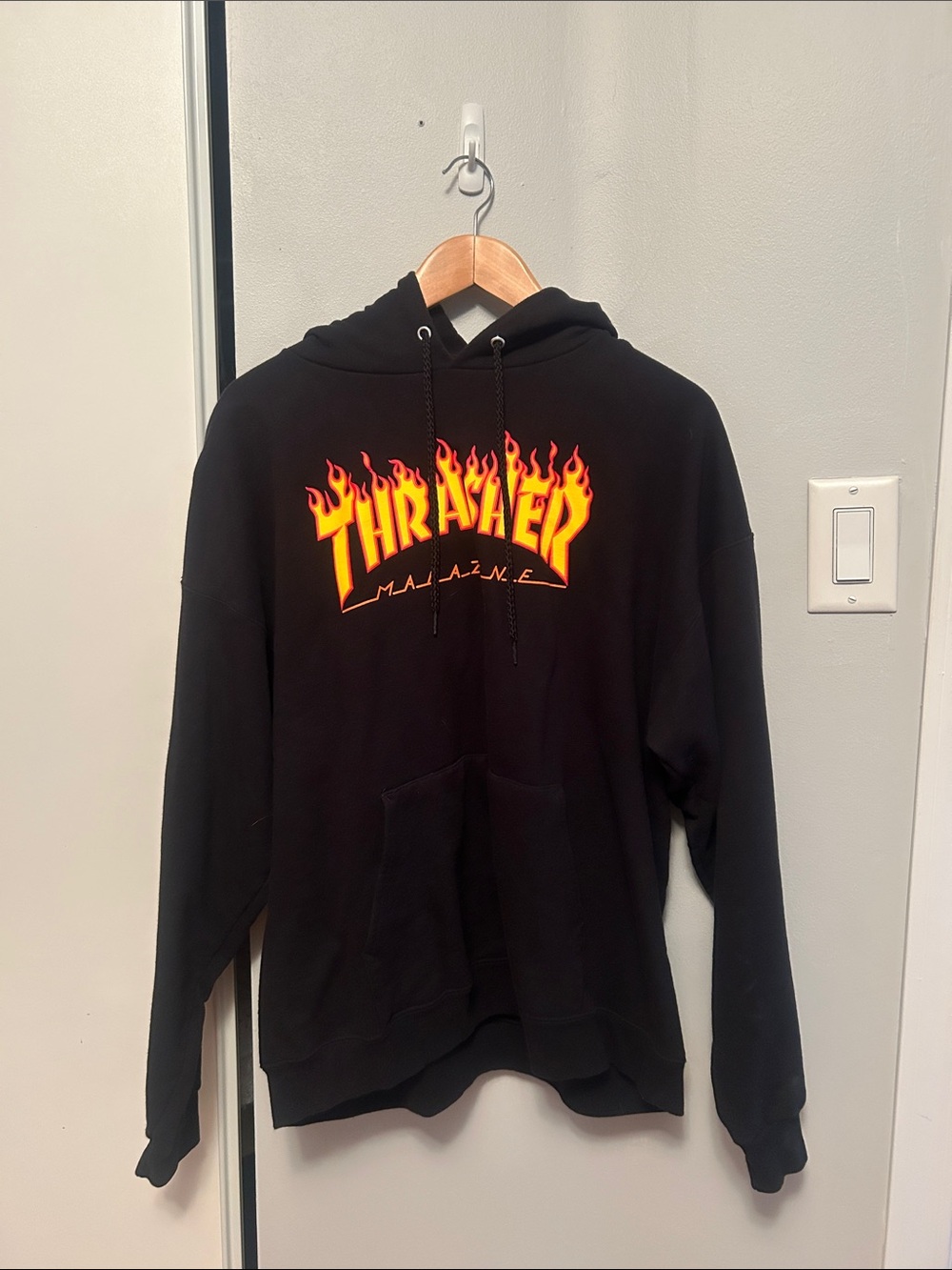 Thrasher Black Hoodie with Yellow-Orange Flame Logo